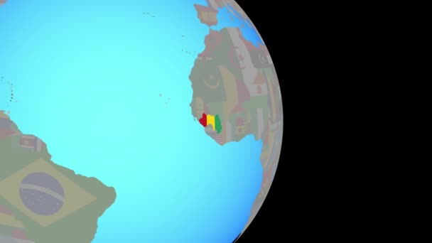 Zoom a Guinea con bandera en el globo — Vídeo de stock