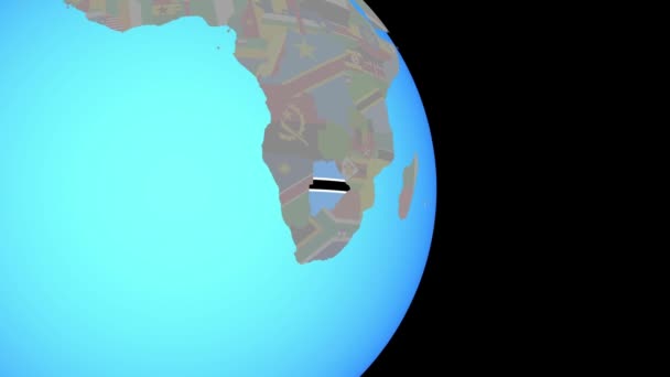 Zoom naar Botswana met vlag op wereldbol — Stockvideo