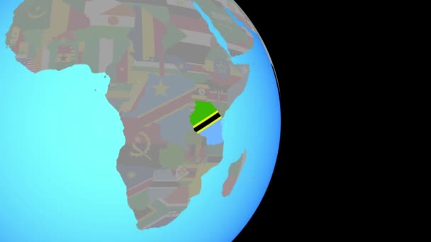 Zooma in i Tanzania med flaggan på jorden — Stockvideo