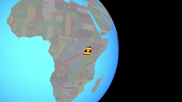 Приблизиться к Уганде с флагом на глобусе — стоковое видео