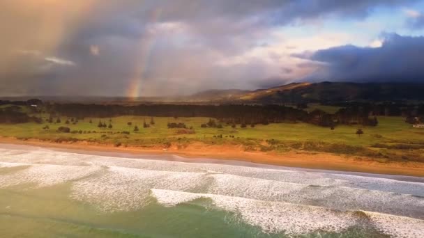 Rainbow and stormy clouds by the sea — Stock Video
