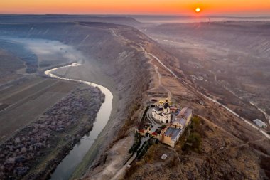 Republic of Moldova Old Orhei Monastery and Butuceni Village aerial view at sunrise clipart