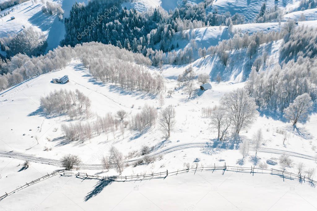Aerial view of a peasant village covered with snow in Transylvania, Romania