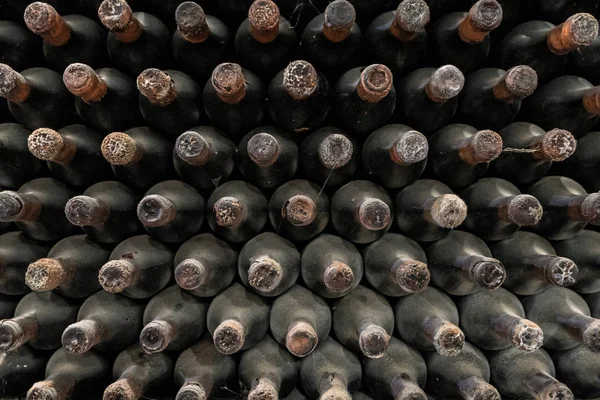 Wine bottles pattern stacked in winery — Stock Image Wine Bottles Pattern Stacked Winery Stock Picture