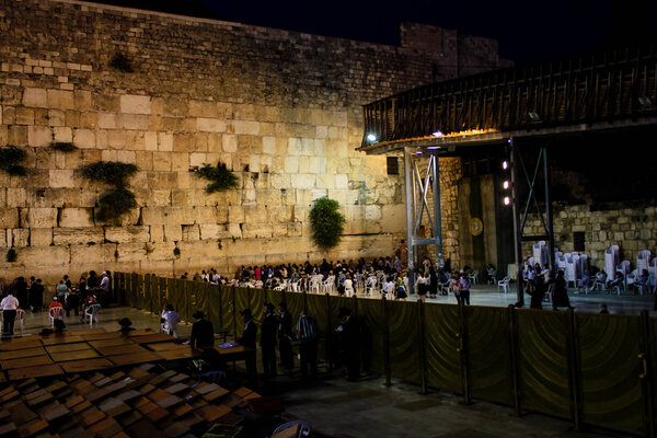 Jerusalem Israel May 17, 2018 Unknowns people praying front the Western Wall in the Old city of Jerusalem in the evening