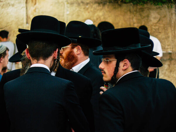 Jerusalem Israel June 07, 2018 View of unknowns people praying front the Western Wall in the old city of Jerusalem in the evening