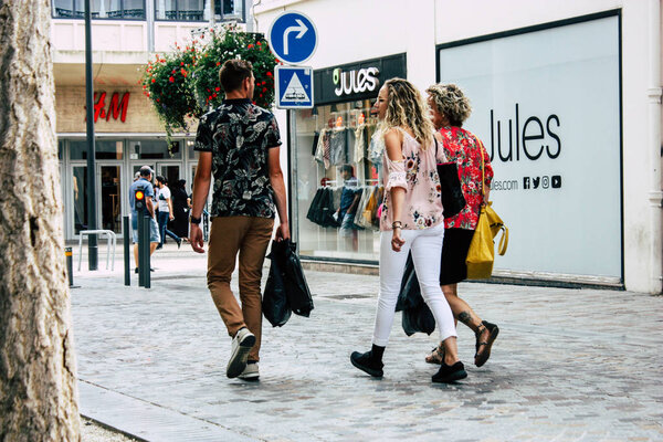 Reims France July 23, 2018 View of unknowns people walking in the street of Reims in the afternoon