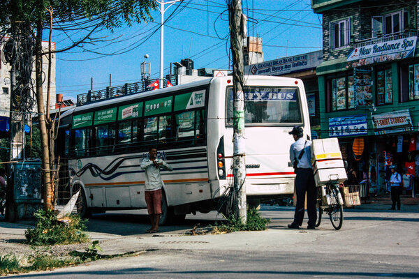 Pokhara Nepal October 12, 2018 View of a traditional Nepali local bus driving in New street at pokhara in the afternoon