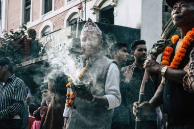 Bandipur Nepal October 16, 2018 View of unknowns people attend to an Hindu religious ceremony in the main street of Bandipur in the afternoon