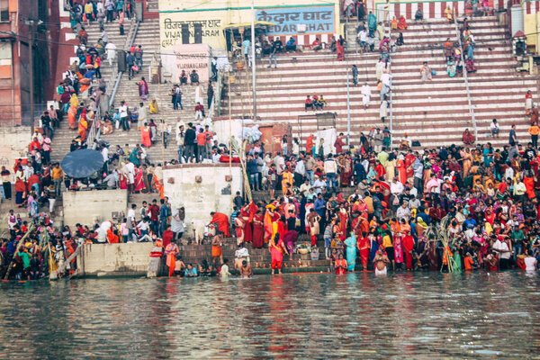 Varanasi India November 14, 2018 View of unknowns Indians people attending and celebrating Dev Deepavali on the banks of the Ganges river in the morning during the sunrise