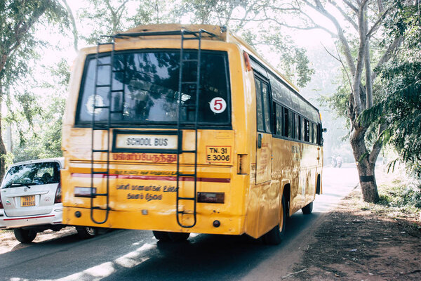 Auroville Tamil Nadu January 24, 2019 View of a school bus from Auroville driving in southern India in the afternoon