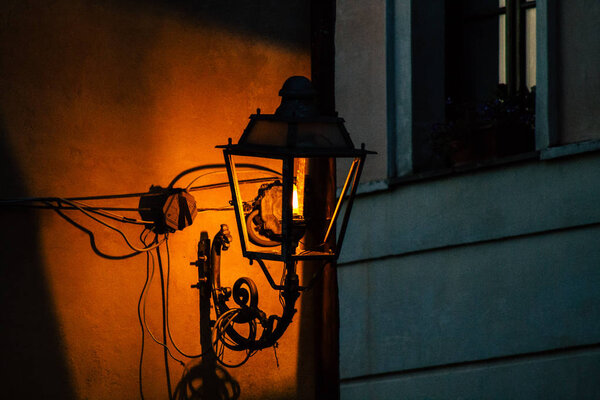 Calcata Italy September 18, 2019 View of street lamp on the facade of the building in the streets of Calcata in the evening