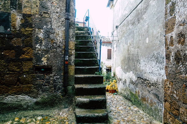 Calcata Italy September 22, 2019 View of the street under the rain in the medieval village of Calcata near Rome in the afternoon