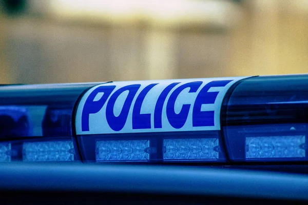 Closeup of an official police car patrolling the streets of the city center of the metropolitan area