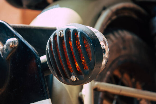 Closeup of a motorcycle rolling in the streets of the city center of the metropolitan area