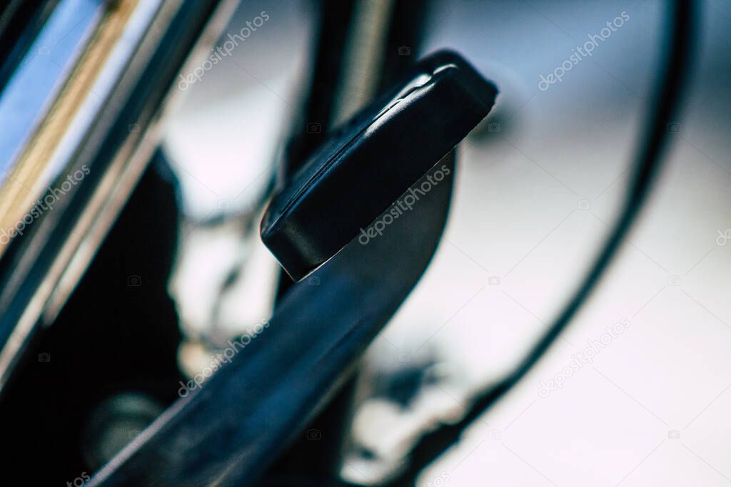 Closeup of a motorcycle rolling in the streets of the city center of the metropolitan area