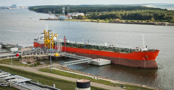 The oil tanker is moored at the petroleum product terminal in the port of Klaipeda
