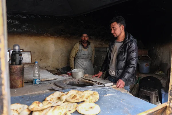 stock image Leh, India - April 26 2017 :  Indian men in thier own shop  baking 