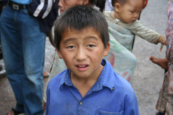 Xieng Khouang , Laos - June 16, 2005 : Laotian Hmong children in a village by the road near Xieng Khouang Province