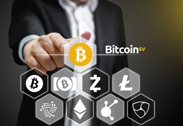 Concept of a Business man pointing at Bitcoin SV coin, a Cryptocurrency blockchain platform , Digital money — Stock Photo, Image