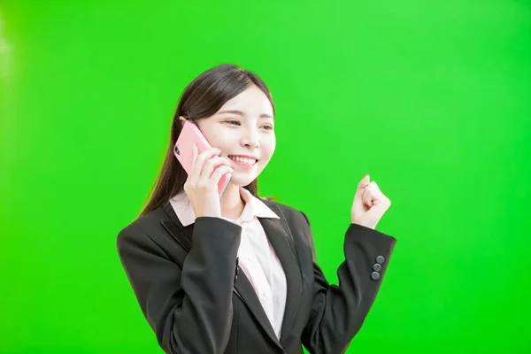 Business Woman Using Phone Green Background — стоковое фото