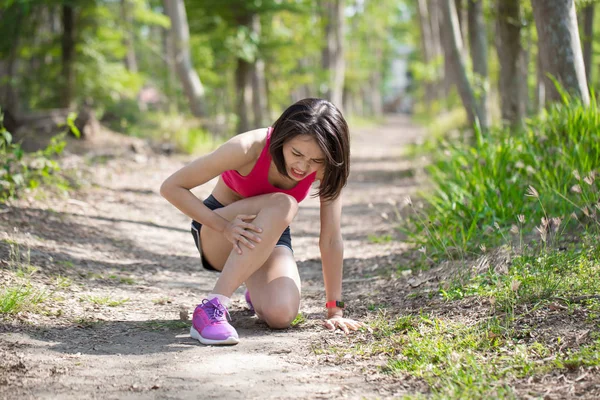 Sport woman feeling pain with calf strain in the forest — Stock Image Sport Woman Feeling Pain Calf Strain Forest Stock Picture