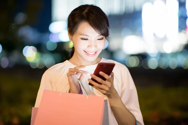 Woman Use Phone Happily Take Shopping Bag Night — Stock Photo, Image