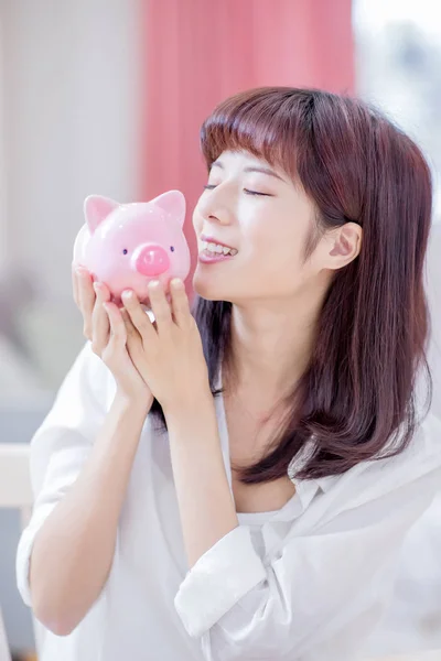 Happy Woman Money Her Pink Piggy Bank Kiss Home — Stock Photo, Image