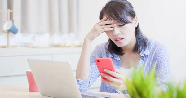 woman suffer internet cyber bullying and feel depressed with smart phone at home