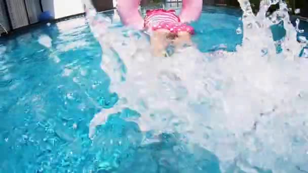 Cute girl kicking water — Stock Video