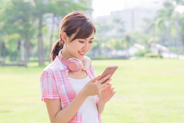Young asian woman use phone — Stock Photo, Image