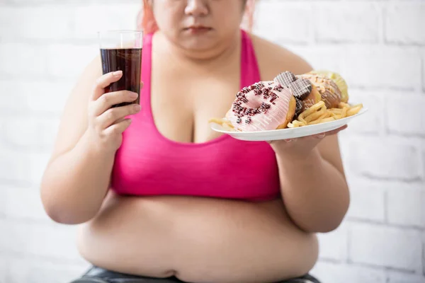 Plus size girl with dessert — Stock Photo, Image