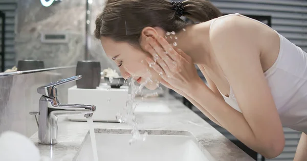 beauty woman wash her face