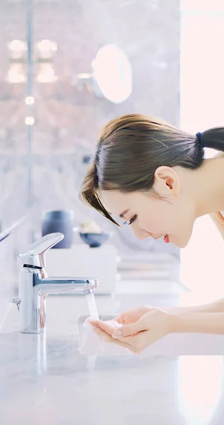 beauty woman wash her face