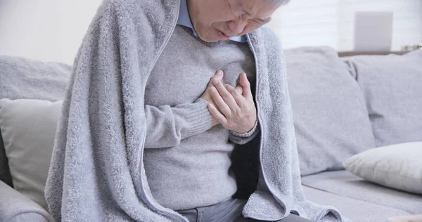 Asian elderly man feel chest pain — Stock Photo, Image