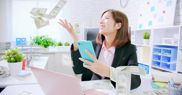 Business woman with raining money — Stock Photo, Image