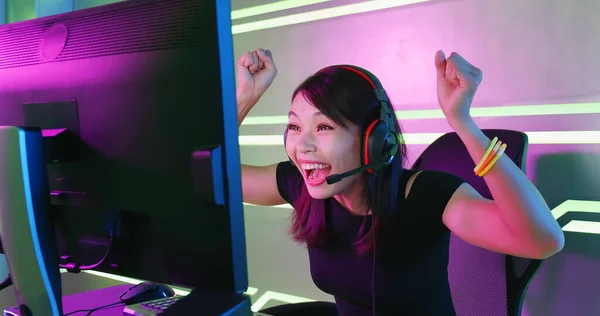 Footage of Young Asian esport woman gamers playing online video games on  the computer with neon light at home. Attractive girl gaming player feels  enjoy technology broadcast live streaming. 25213471 Stock Video