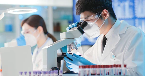 Asian Microbiologist Biotechnology Researcher Medical Worker Look Microscope Lab Royalty Free Stock Photos