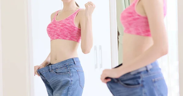 Asian Sport Woman Wear Old Loose Jeans Look Miror Celebrating — Stock Photo, Image