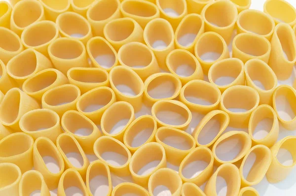 Pasta Paccheri on a white background. Selective focus — Stock Photo, Image