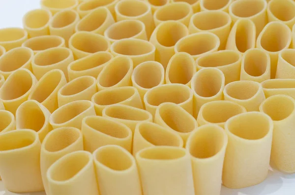 Pasta Paccheri on a white background. Selective focus — Stock Photo, Image