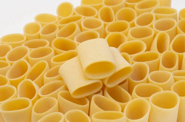 Pasta Paccheri on a white background. Selective focus — Stock Photo, Image