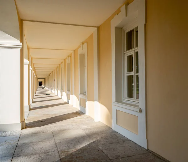 arched corridor of the Palace in Oranienbaum Park on a Sunny summer day