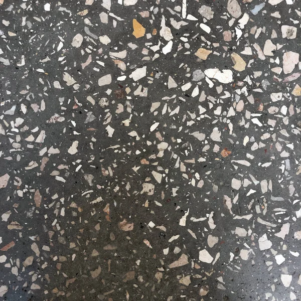 Гранитная мозаичная текстура. бетонный фон с белой галькой — стоковое фото