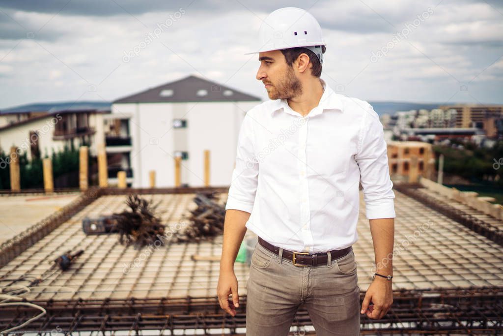 Portrait of confident architect, engineer on building construction site
