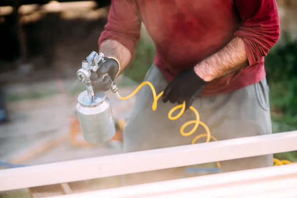 Construction Worker Painting Timber Spraygun Airgun Carpentry Details — Stock Photo, Image