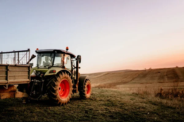 Farmer using modern tractor for harvesting