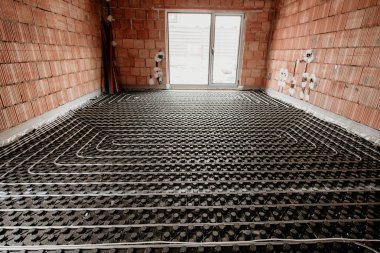 Radiant floor construction installation with flexible pipes. Installation of underfloor heating clipart