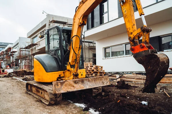 Heavy duty industrial machinery excavator working on construction site