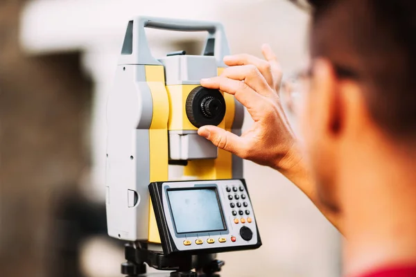 Close up details of surveyor engineer working with total station theodolite and gps system — Stock Photo, Image